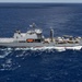 Multinational ships sail in formation during RIMPAC 2024
