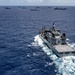 Multinational ships sail in formation during RIMPAC 2024