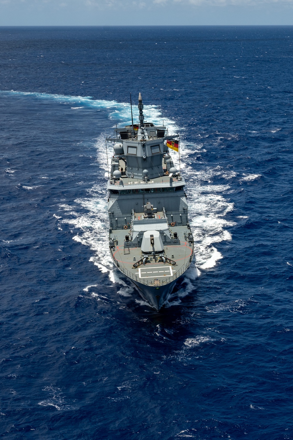 Multinational ships sail in formation during RIMPAC 2024