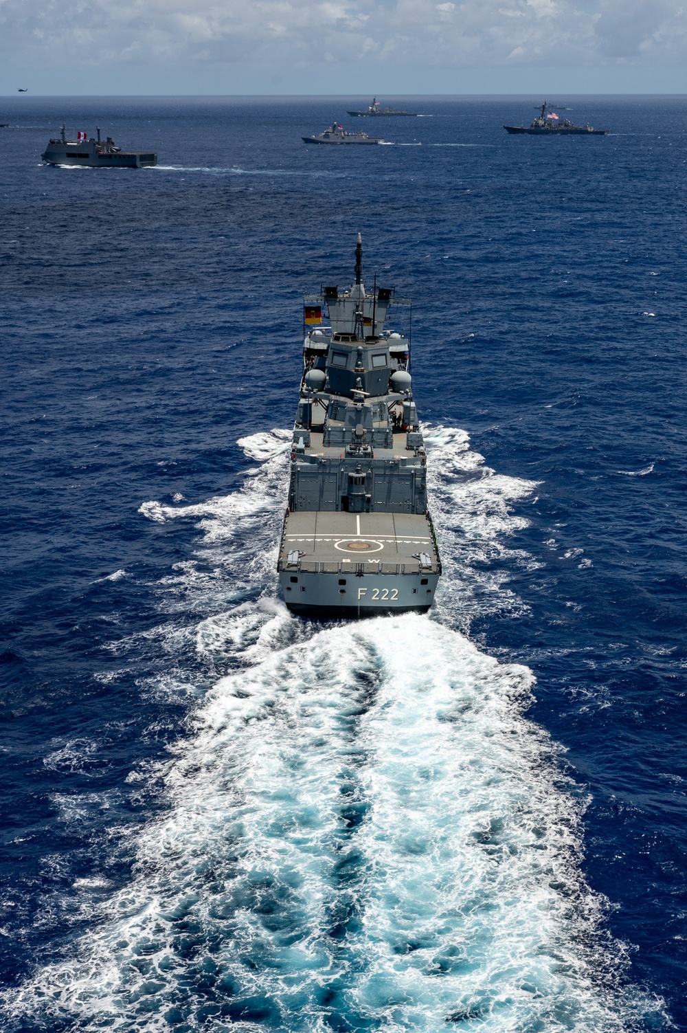 Multinational ships sail in formation during RIMPAC 2024