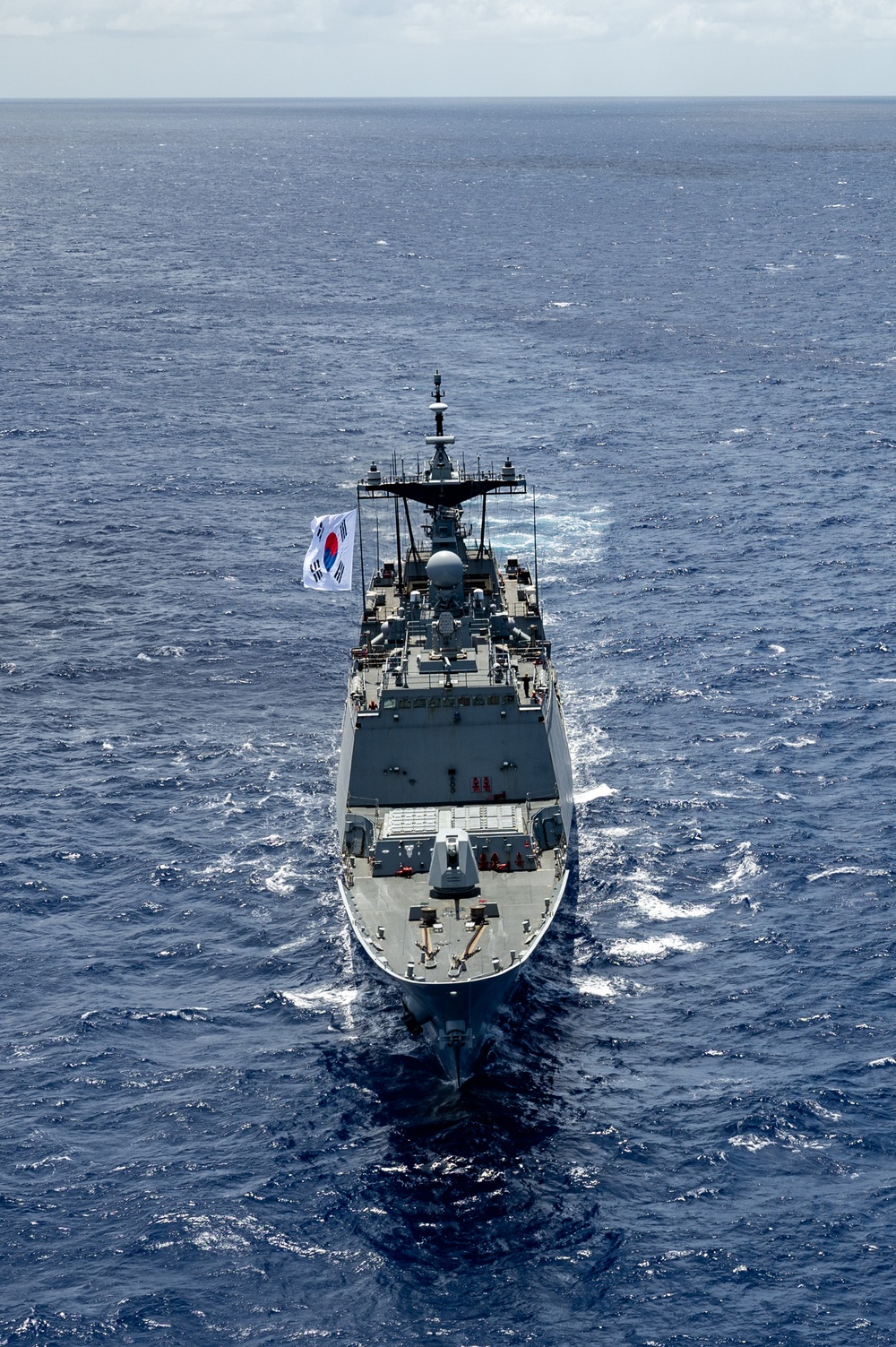 Multinational ships sail in formation during RIMPAC 2024