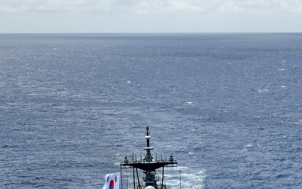 Multinational ships sail in formation during RIMPAC 2024