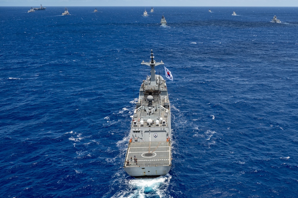 Multinational ships sail in formation during RIMPAC 2024