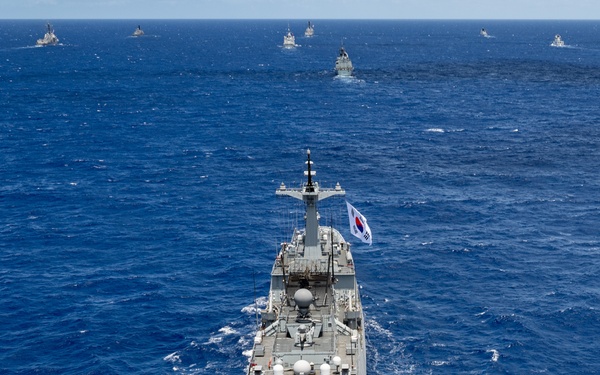 Multinational ships sail in formation during RIMPAC 2024