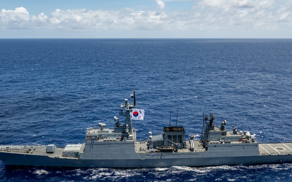 Multinational ships sail in formation during RIMPAC 2024