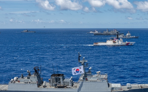 Multinational ships sail in formation during RIMPAC 2024