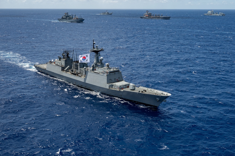 Multinational ships sail in formation during RIMPAC 2024
