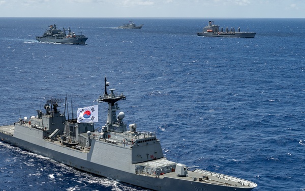 Multinational ships sail in formation during RIMPAC 2024