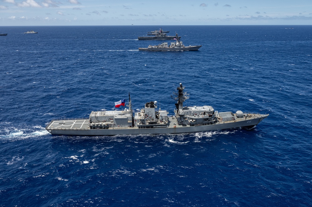 Multinational ships sail in formation during RIMPAC 2024