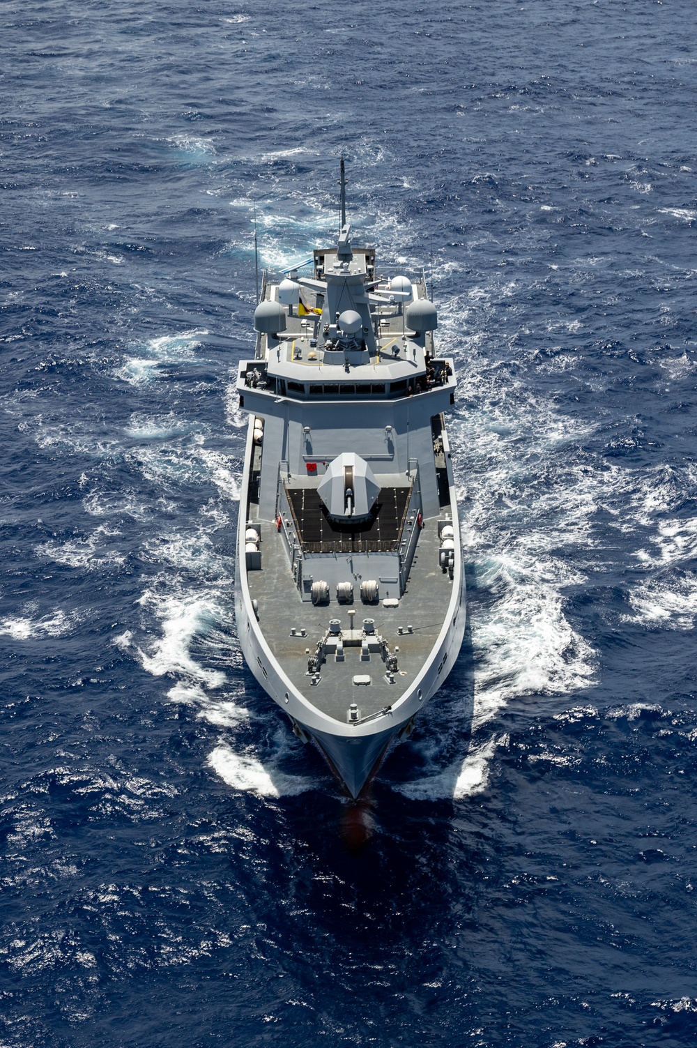 Multinational ships sail in formation during RIMPAC 2024