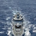 Multinational ships sail in formation during RIMPAC 2024