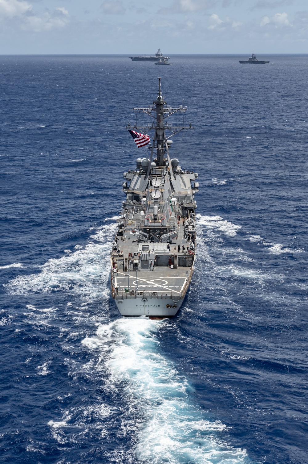 Multinational ships sail in formation during RIMPAC 2024