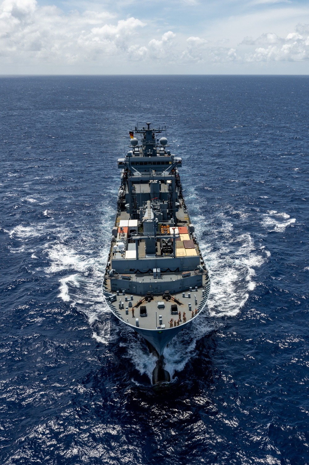 Multinational ships sail in formation during RIMPAC 2024