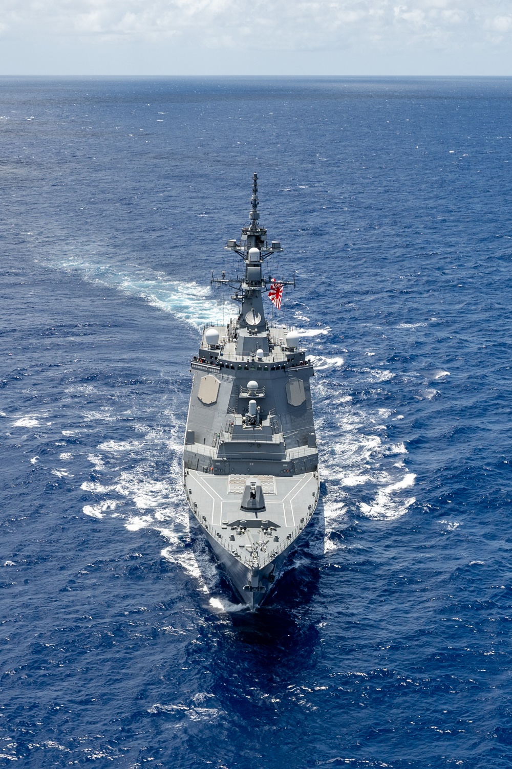Multinational ships sail in formation during RIMPAC 2024