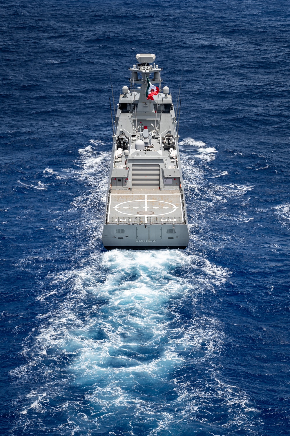 Multinational ships sail in formation during RIMPAC 2024