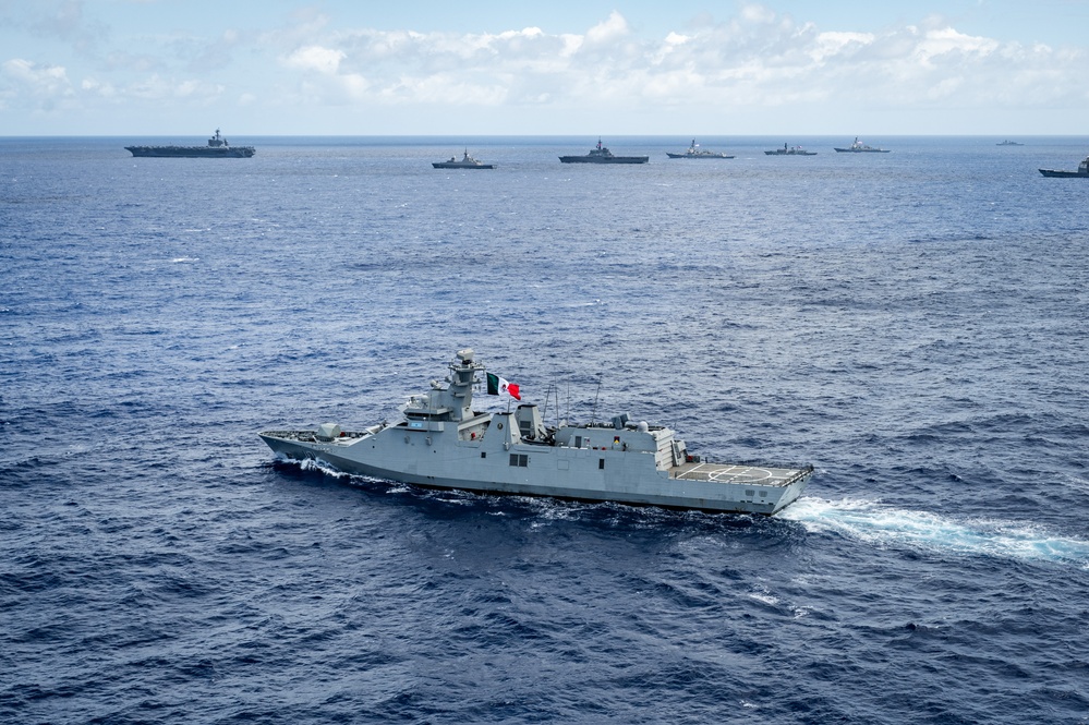 Multinational ships sail in formation during RIMPAC 2024