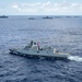 Multinational ships sail in formation during RIMPAC 2024