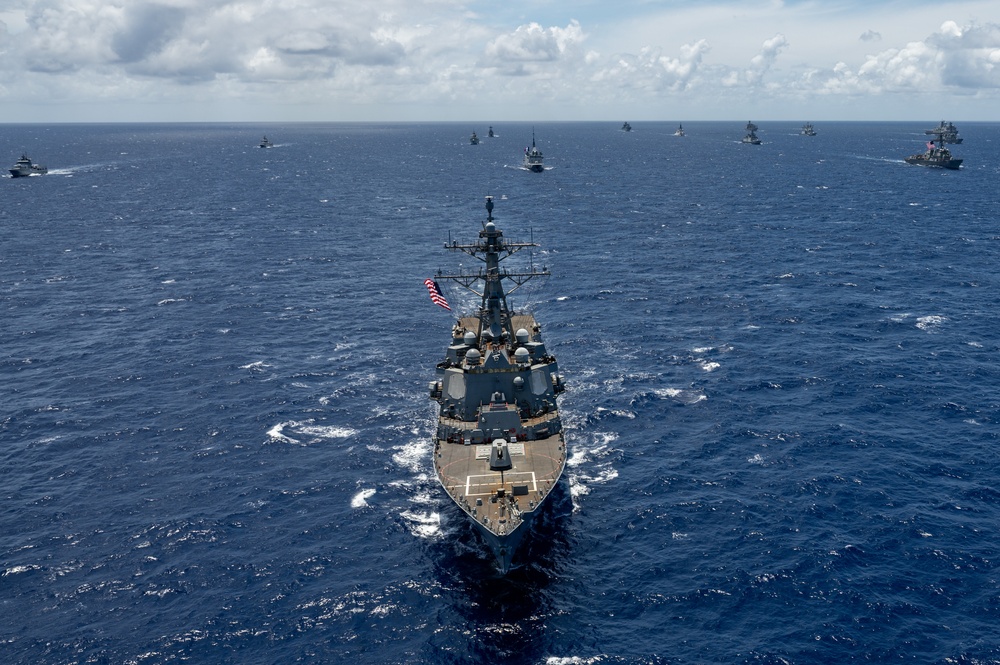 Multinational ships sail in formation during RIMPAC 2024