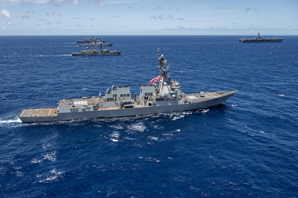 Multinational ships sail in formation during RIMPAC 2024