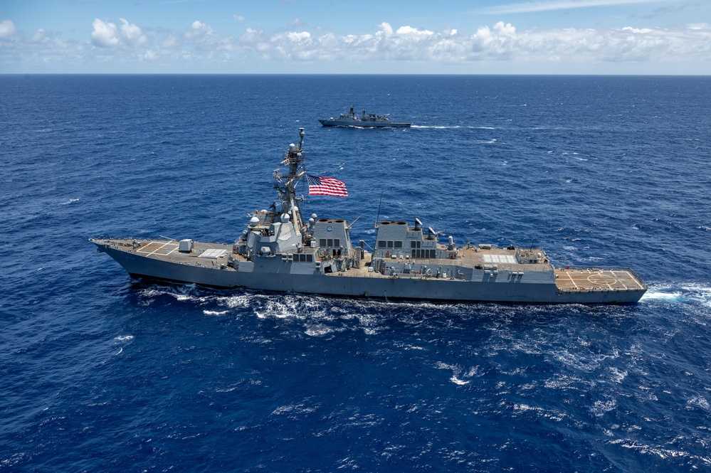 Multinational ships sail in formation during RIMPAC 2024