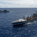 Multinational ships sail in formation during RIMPAC 2024