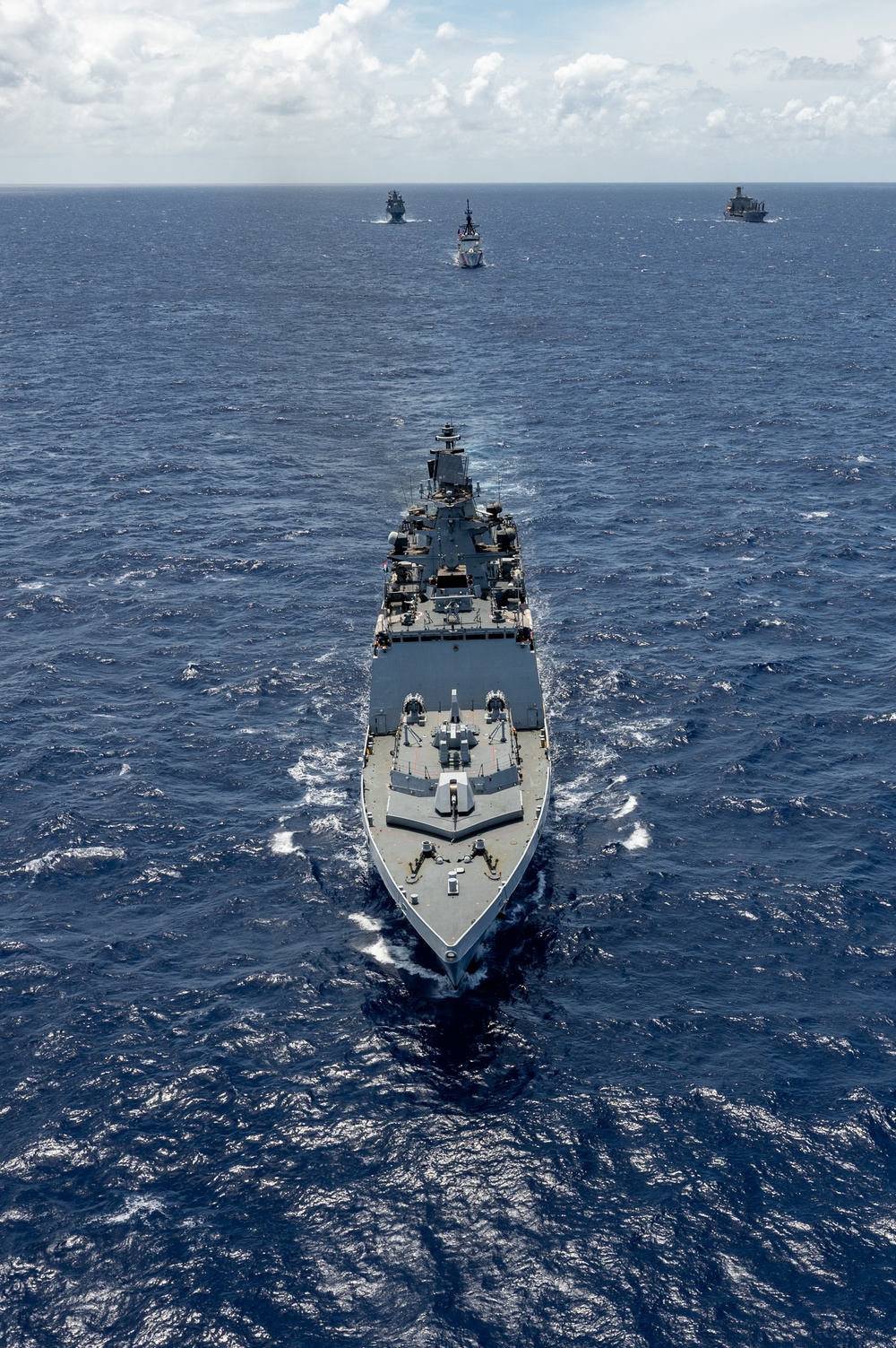 Multinational ships sail in formation during RIMPAC 2024