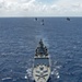 Multinational ships sail in formation during RIMPAC 2024