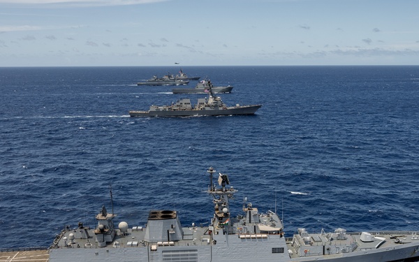 Multinational ships sail in formation during RIMPAC 2024