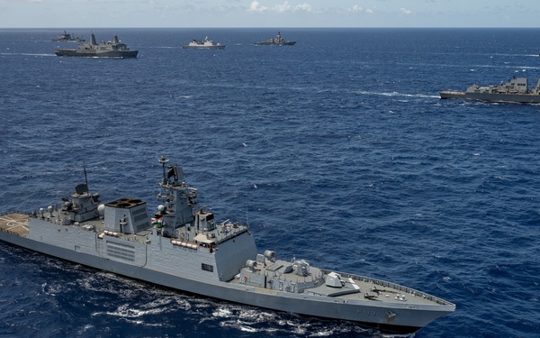 Multinational ships sail in formation during RIMPAC 2024