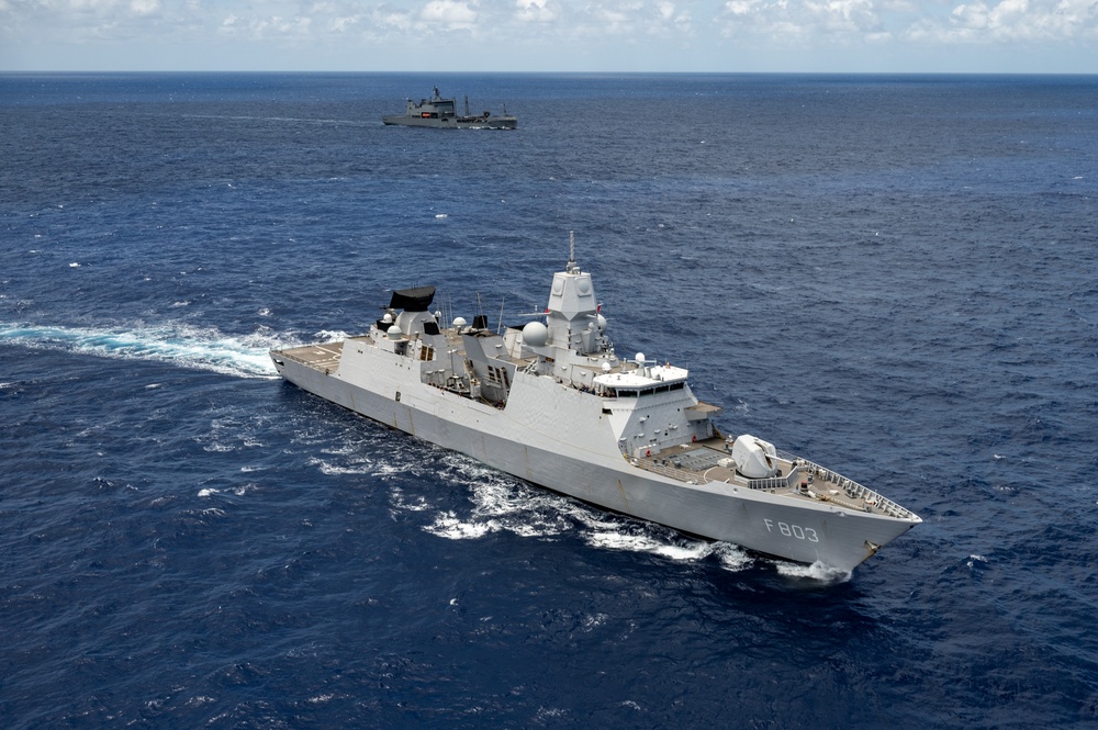 Multinational ships sail in formation during RIMPAC 2024