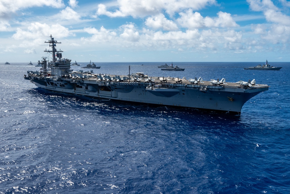 Multinational ships sail in formation during RIMPAC 2024