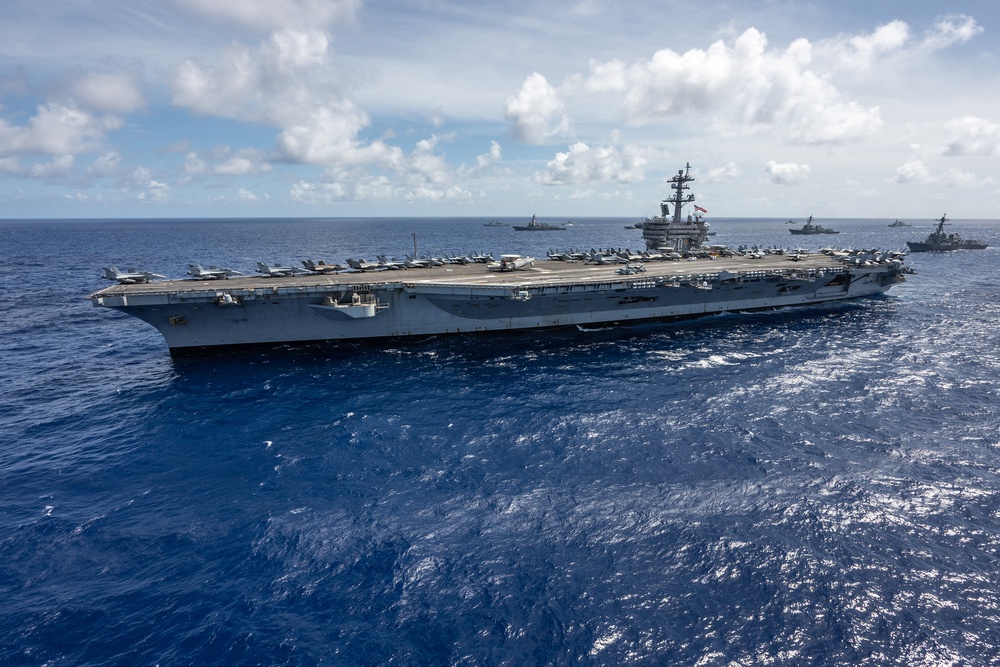 Multinational ships sail in formation during RIMPAC 2024