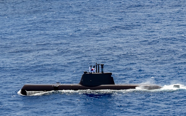 Multinational ships sail in formation during RIMPAC 2024