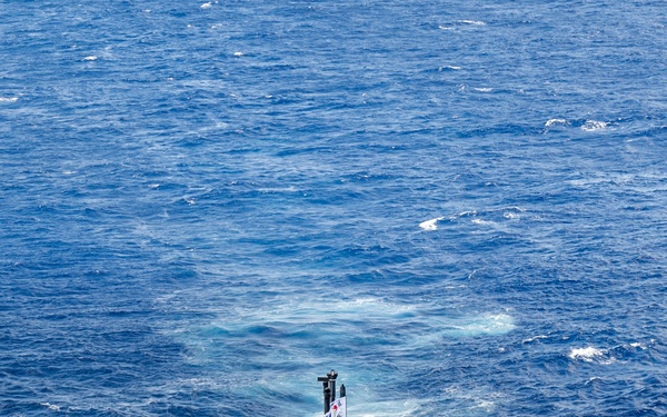 Multinational ships sail in formation during RIMPAC 2024