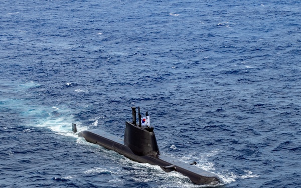 Multinational ships sail in formation during RIMPAC 2024