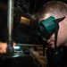 Nimitz Sailor Brazes A Pipe