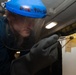 Nimitz Sailor Applies Paint Remover