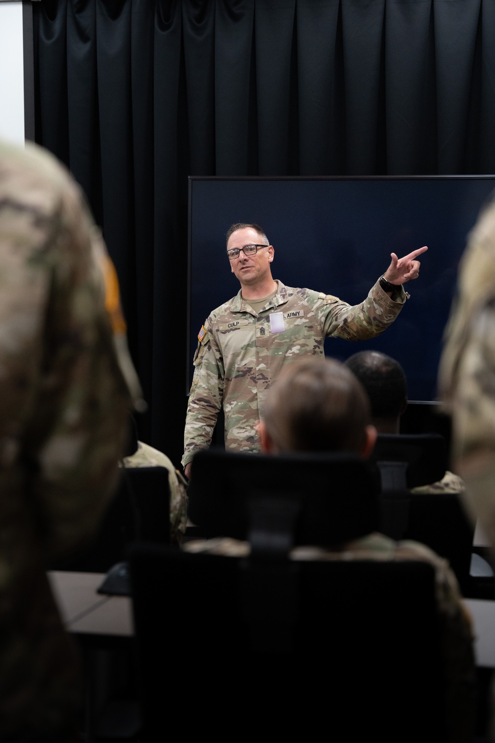 Command Sergeant Major Tully J. Culp briefs soldiers of the 139th Medical Brigade headquarters and headquarters company at Fort Knox, Kentucky July 25, 2024