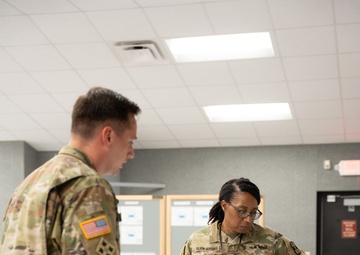 Sergeant Samuel Morrison briefs Deputy Commanding General Cindy M. Saladin-Muhammad at Fort Knox, Kentucky July 25, 2024