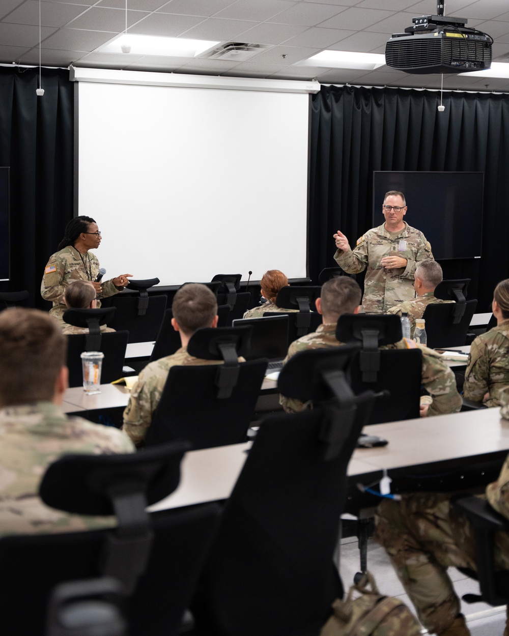 Deputy Commanding General Cindy M. Saladin-Muhammad and Command Seargeant Major Tully J. Culp brief soldiers of the 139th Medical Brigade Headquarters and Headquarters company at Fort Knox, Kentucky July 25, 2024