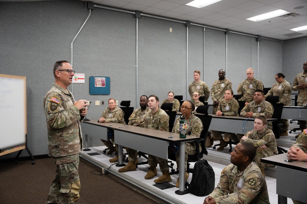 Command Sergeant Major Tully J. Culp briefs soldiers of the 139th Medical Brigade headquarters and headquarters company at Fort Knox, Kentucky July 25, 2024