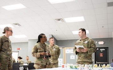 Specialist Robert Womack briefs Deputy Commanding General Cindy M. Saladin-Muhammad at Fort Knox, Kentucky July 25, 2024