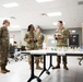 Specialist Robert Womack briefs Deputy Commanding General Cindy M. Saladin-Muhammad at Fort Knox, Kentucky July 25, 2024