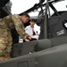 Military members talk with visiting rocketeer teams during FIA 2024