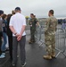 Military members talk with visiting rocketeer teams during FIA 2024