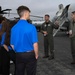 Military members talk with visiting rocketeer teams during FIA 2024