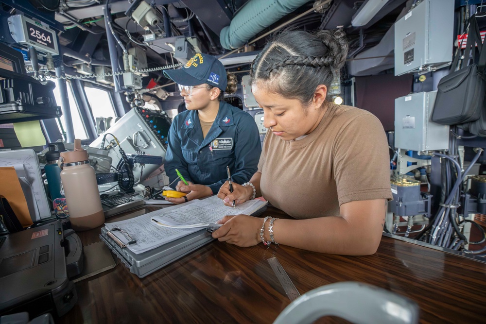 USS Spruance Sailors stands watch