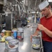 USS Spruance Sailor prepares food for dinner