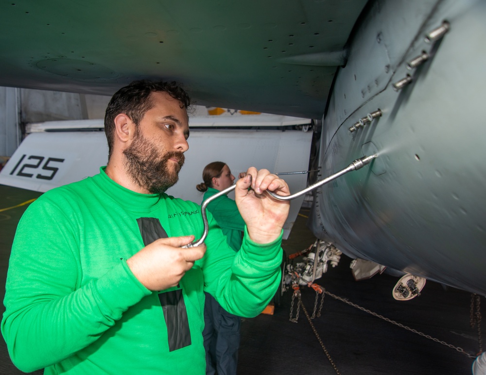 A Nimitz Sailor Removes Jet Engine Access Doors