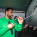 A Nimitz Sailor Removes Jet Engine Access Doors